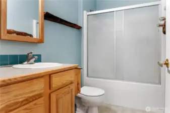 Full bathroom down hallway.