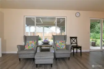 living room with garden views/ patio entry