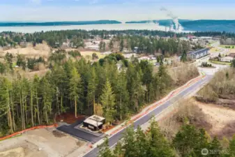 The main entry road, Rainier, has been newly paved and will include sidewalks and bike paths. This is a beautiful oasis but still close to town and all Port Townsend offers. Port Townsend Bay is in the distance, just a short drive or hike away.