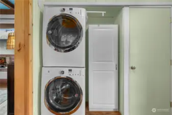 Convenient laundry area on the other side of the kitchen. Door accesses the unfinished basement.