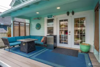 Covered Trex deck, off the kitchen, is a great place to hang out during the summer.