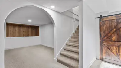 Lower level landing. Furnace/hot water are behind barn door