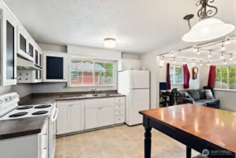 Kitchen with large window overlooking the private back yard.