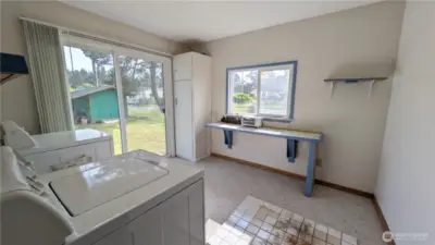 Laundry/utility room with sliding doors to spacious yard