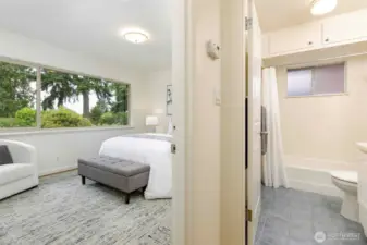 Two light-filled main-floor bedrooms with hardwood floors, generous closets, and easy access to a full bath—comfortable and quiet retreats in this peaceful Broadview neighborhood.