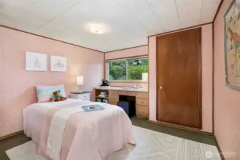 Private downstairs bedroom perfect for guests, located near a second full bathroom for added convenience.