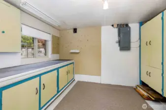 Versatile workshop or craft area with ample space for projects, storage, and hobbies—plus direct access to the backyard.
