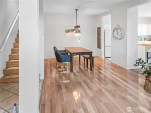 View of formal dining room and stairs to second level.