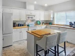 Large kitchen with plenty of natural light.