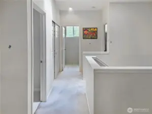 View to the second bedroom, bath and upstairs laundry area.