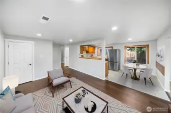 An open and inviting layout connects the living and dining spaces, creating the perfect spot to relax or entertain. *virtually staged*