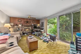 Family room has hardwood floors under the carpet.