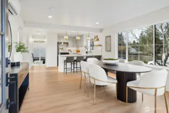 Enter into bright open concept space illuminated by expansive colonial style grid windows