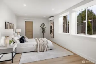 Primary bedroom with lots of natural light