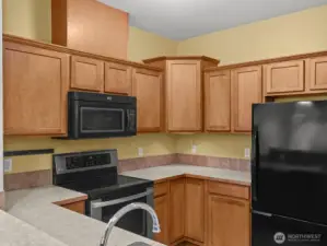 You'll find plenty of counter and cabinet space in this nice sized kitchen.