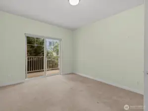 Across the hall is the 2nd bedroom which also has balcony access.