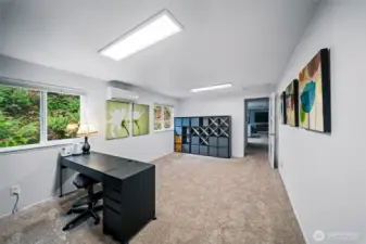 This bonus room links the main house to the primary suite and is a great spot for an office, library, media room, craft room....you name it. The ultimate flex space