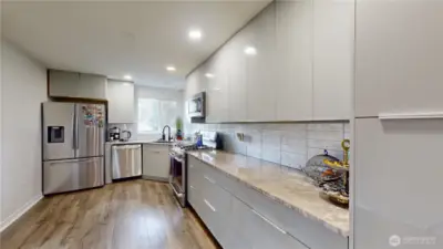Main kitchen with new cabinets and Quartz counters.