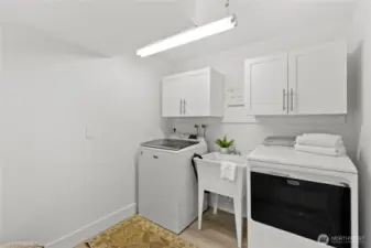 Remodeled laundry room located in lower level