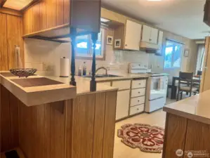 The kitchen has its own breakfast bar.