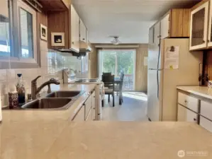 Great cabinets and counter space. The dining room is right beside the kitchen.