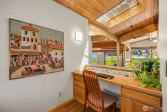 Cozy office on second floor, beyond kitchen.