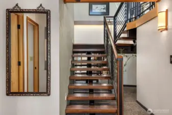 Beautiful custom stairs and rails grace the entry hall