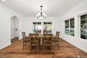 Formal dining room (virtually staged) that is great for small and large groups.