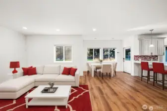Open concept living room adjacent to the kitchen & eating nook. Overlooks the backyard which has trees behind it for added privacy and a beautiful view.
