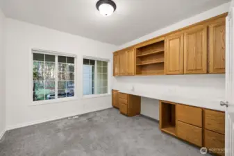 Home office overlooking the front yard. Plenty of work room and storage space.