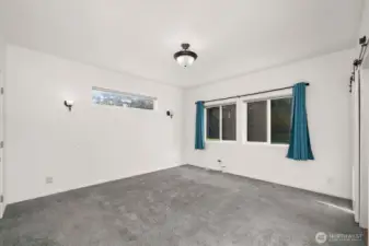 Primary bedroom is light and bright. Great views from the windows.