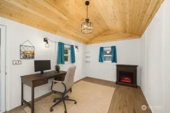 Virtually staged She shed that would  make a great home office or art studio. Had A/C via a new minisplit.