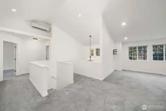 Upstairs landing with large bonus room a vaulted ceilings. Plus mini splits for A/C and heating.