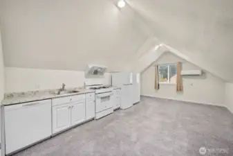 Overview of the upstairs kitchen. Vaulted ceilings and mini split for A/C and heating.