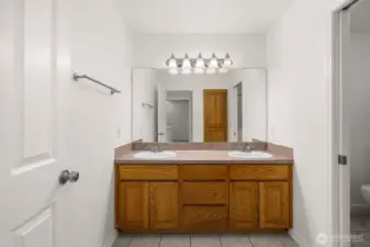 Upstairs full bathroom, one side.