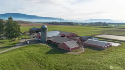 SE Views of the mountains , land and farm buildings