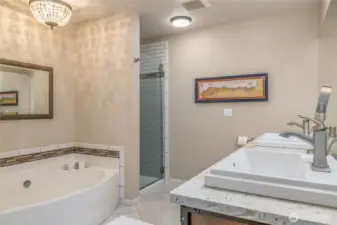 This spa-like retreat features a spacious 5-piece layout, beautiful quartz countertops, and a soaking tub perfect for unwinding