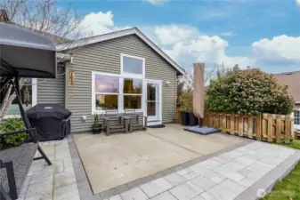 Spacious patio off the living room, extended in 2025 with professionally-installed pavers for the ultimate outdoor entertaining space