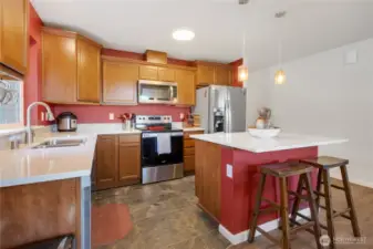Stainless Steel appliances, Quartz Counters, Tile Floors.  Center island with breakfast bar!