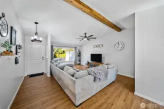 Updated stem to stern, there is hardly a finish in this home that has not been polished or replaced. Large, airy living room with a newer, stylish faux beam, LVP flooring and a newer picture window