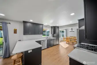Durable and easy care quartz counters and a full height subway tile backsplash