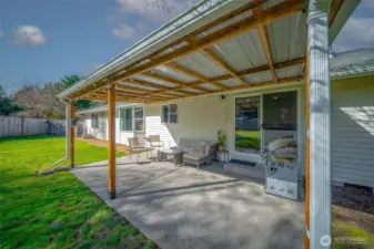 The owners thoughtfully added some outdoor living space via this covered patio, for year 'round enjoyment. So important in our climate