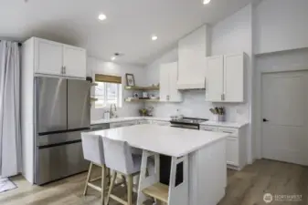 The appliances stay with the home.  Notice the newer high end refrigerator