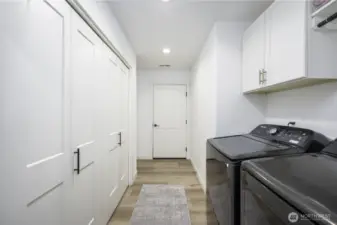 This is the utility room with the pantry on the left