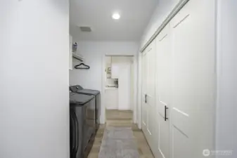The door at the end leads into the two car garage with built-in shelving