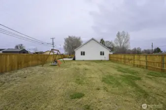 The back yard in completely fenced with lots of room for one's choice from RV or boat parking, sports activities and games; but also a shop or even an ADU perhaps