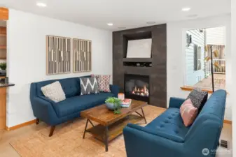 Lower-level family room & gas fireplace.