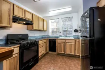 Propane cook stove & range, refrigerator and dishwasher included.