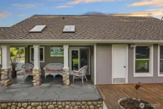 Covered patio area on south side of home with skylights and stamped concrete.