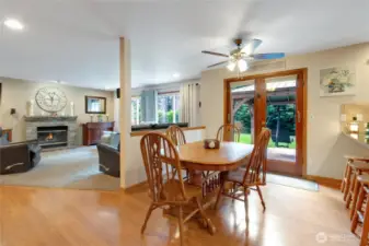 Charming eating nook situated between the kitchen and family room, featuring French doors with direct access to the beautiful backyard, creating a seamless indoor-outdoor dining experience.